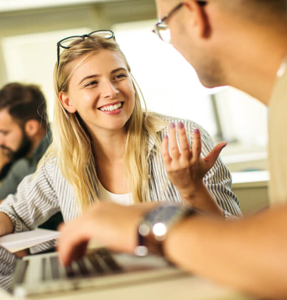 A female student talking with a peer